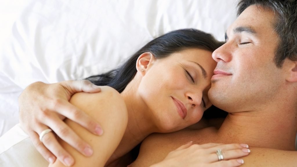 happy couple on the bed