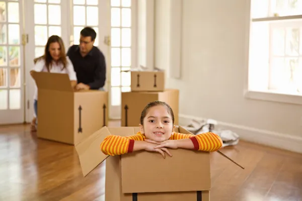 family in a room with boxes
